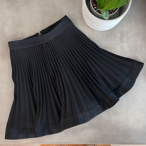 bebe Dresses & Skirts - Bebe Pleated Flare Miniskirt